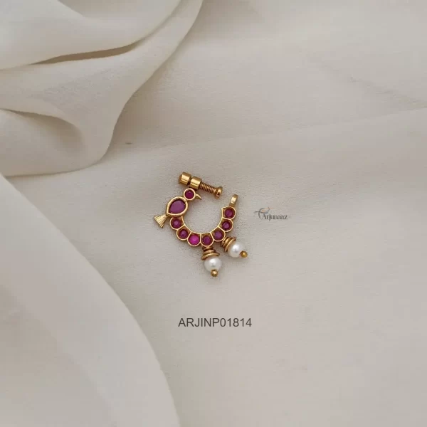 The Full Ruby Bird Nose Pin showcases a stunning bird design entirely adorned with rich ruby stones.